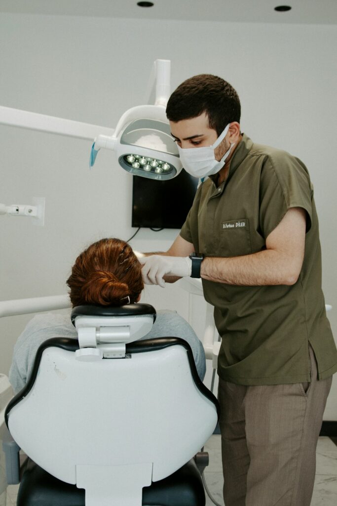 a-dentist-examining-a-patient-gxctdhxhbxm